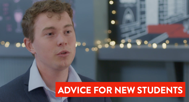 Talking student near some fairy lights